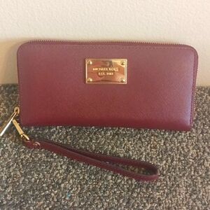 Michael Kors large burgundy leather accordion wristlet wallet